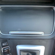 the front edge of the cup holder cover is exposed when open so it takes the brunt of drink spills. I couldn’t get it right. You can also see the smudges on the shifter surround.